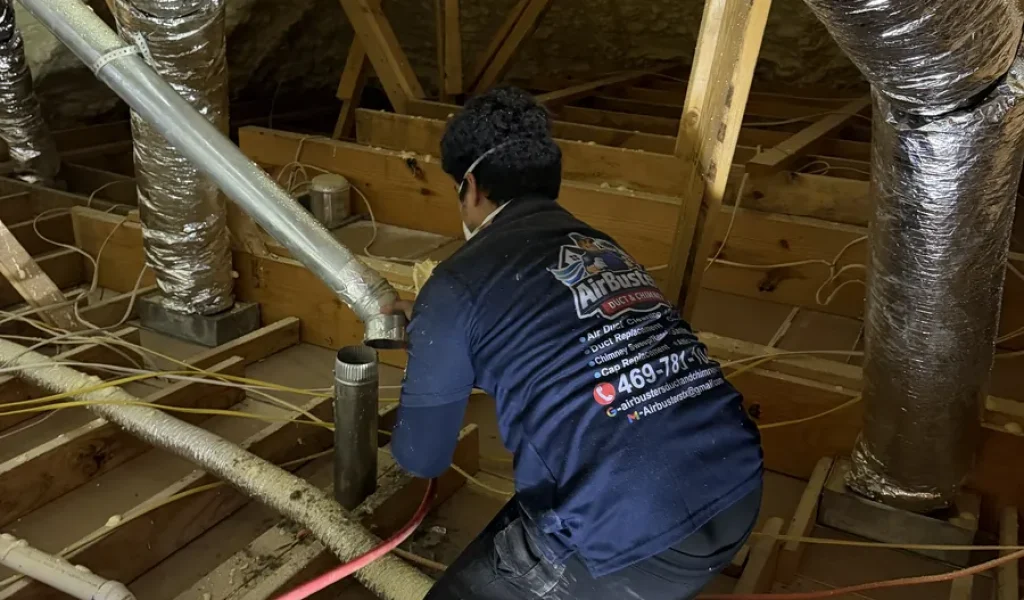 Air Busters technician sealing flex duct at the plenum