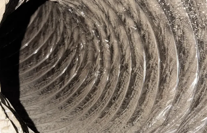 Freshly cleaned flexible air duct interior after professional cleaning in DFW